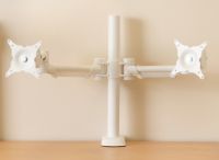 Dual monitor arm, manually adjustable. White.