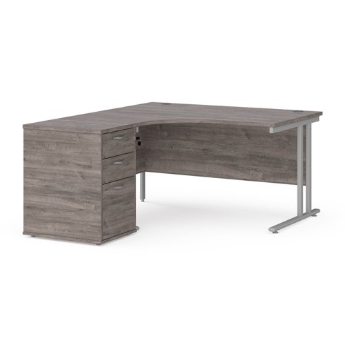 Maestro 25 left hand ergonomic desk 1400mm with silver cantilever frame and desk high pedestal - grey oak Office Desks EBS14LGO