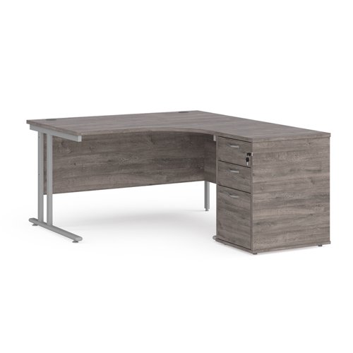 Maestro 25 right hand ergonomic desk 1400mm with silver cantilever frame and desk high pedestal - grey oak
