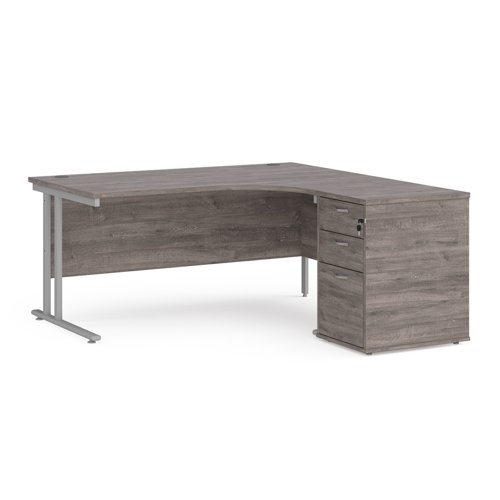 Maestro 25 right hand ergonomic desk 1600mm with silver cantilever frame and desk high pedestal - grey oak