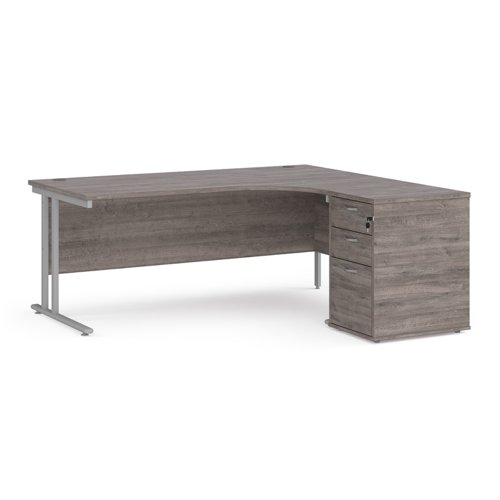 Maestro 25 right hand ergonomic desk 1800mm with silver cantilever frame and desk high pedestal - grey oak