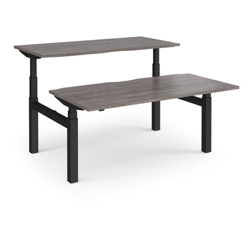 Elev8 Touch sit-stand back-to-back desks 1600mm x 1650mm - black frame, grey oak top