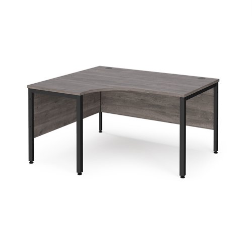 Maestro 25 left hand ergonomic desk 1400mm wide - black bench leg frame, grey oak top