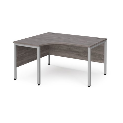Maestro 25 left hand ergonomic desk 1400mm wide - silver bench leg frame, grey oak top