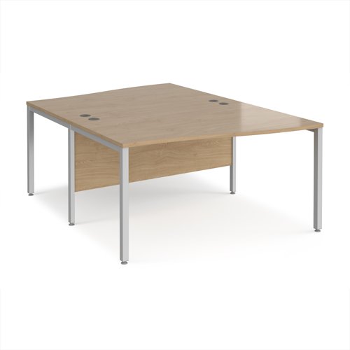 Maestro 25 back to back wave desks 1400mm deep - silver bench leg frame, Kendal Oak top
