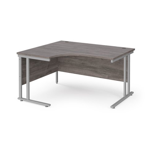 Maestro 25 left hand ergonomic desk 1400mm wide - silver cantilever leg frame, grey oak top MC14ELSGO Buy online at Office 5Star or contact us Tel 01594 810081 for assistance