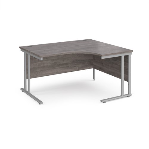 Maestro 25 right hand ergonomic desk 1400mm wide - silver cantilever leg frame, grey oak top MC14ERSGO Buy online at Office 5Star or contact us Tel 01594 810081 for assistance