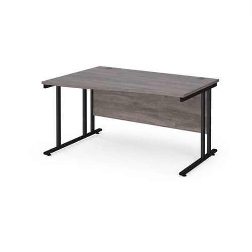Maestro 25 left hand wave desk 1400mm wide - black cantilever leg frame, grey oak top MC14WLKGO Buy online at Office 5Star or contact us Tel 01594 810081 for assistance