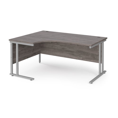 Maestro 25 left hand ergonomic desk 1600mm wide - silver cantilever leg frame, grey oak top