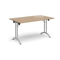 Rectangular folding leg table with silver legs and curved foot rails 1400mm x 800mm - Kendal Oak