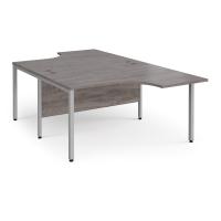 Maestro 25 back to back ergonomic desks 1400mm deep - silver bench leg frame, grey oak top