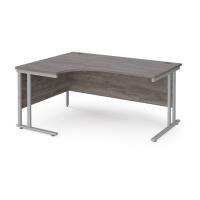 Maestro 25 left hand ergonomic desk 1600mm wide - silver cantilever leg frame, grey oak top