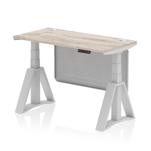 Air Modesty 1200 x 600mm Height Adjustable Office Desk Grey Oak Top Cable Ports Silver Leg With Silver Steel Modesty Panel with Piste Foot