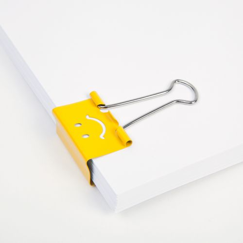 30094RA | Add a little fun to your organising with our bright yellow Emoji foldback clips. Ideal for holding both paper and card, these clips hold documents tightly and securely and can be removed and reused time and time again without damaging the paper.