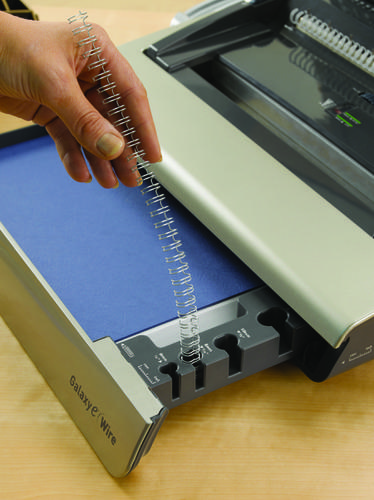 The Galaxy Wire is a heavy duty manual wire binder for large office environments and heavy use. Wire binding enables you to give your documents a top quality wire bound finish whilst the user friendly features make binding heavy workloads more manageable.This wire binding machine comes with the full width punch handle for easy punching of up to 20 sheets with a 130 sheet binding capacity and includes a punch selection for A4 & A5 sized documents for increased flexibility. Vertical sheet loading ensures consistent and accurate punch alignment and preselectable closure control enables easy wire closure.The Galaxy Wire binding machine comes with front access full size storage tray with patented wire & document measure for quick selection of the correct size supplies. Includes a handy chip tray that automatically bursts open when full to eliminate jams.  Includes starter kit for binding 20 documents. Comes with a 2 year warranty