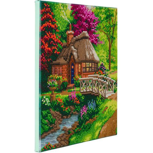 12237CB | Crystal Art Featuring Thomas Kinkade Art, pre-mounted on a Wooden Frame - *Officially Licensed*Our Crystal Art craft kits take our crystal card concept a step further, by enabling you to create beautiful wall art to decorate your home or to give as a handmade gift. The concept is similar to painting by numbers and is also known as 5D Diamond Painting. Each design has a numbered, adhesive template. Use the magic pencil to lift up the coloured resin gems and place them on the corresponding numbered dots. The technique is a relaxing and therapeutic craft activity, suitable for adults and children (ages 6+) alike. The result is a stunning piece of rhinestone art, which you can mount on your wall, or gift to a loved one.Framed canvas size is 30cm x 30cm.