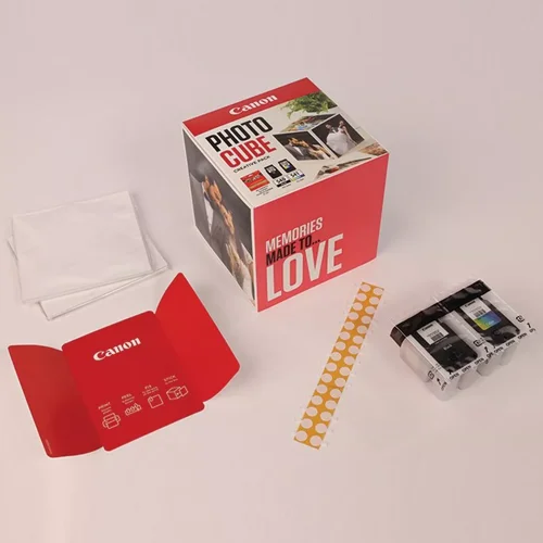 CAN5225B016 | The Photo Cube is a great way to store and display your favourite photos. Small enough to place around your home, you can store your most precious photos inside the box, display the photos on the outside of your box or gift the box to family and friends. You can also use the supplied double-sided tape to decorate the box. The box measures 14 x 14 x 14 cm (approximate), which allows for plenty of space for printed images. The square format is great for social media format printing, making this a great choice for family and friends. This pack is supplied with Genuine Canon PG-540 Black Ink Cartridges, CL-541 C/M/Y Colour Ink Cartridges and 40 5x5” (13 x 13 cm) sheets of square Photo Paper Plus Glossy II, allowing you to get more creative with your printing.