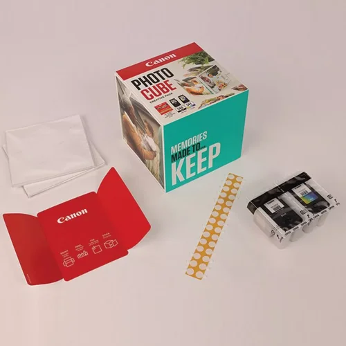 CAN5225B018 | The Photo Cube is a great way to store and display your favourite photos. Small enough to place around your home, you can store your most precious photos inside the box, display the photos on the outside of your box or gift the box to family and friends. You can also use the supplied double-sided tape to decorate the box. The box measures 14 x 14 x 14 cm (approximate), which allows for plenty of space for printed images. The square format is great for social media format printing, making this a great choice for family and friends. This pack is supplied with Genuine Canon PG-540 Black Ink Cartridges, CL-541 C/M/Y Colour Ink Cartridges and 40 5x5” (13 x 13 cm) sheets of square Photo Paper Plus Glossy II, allowing you to get more creative with your printing.