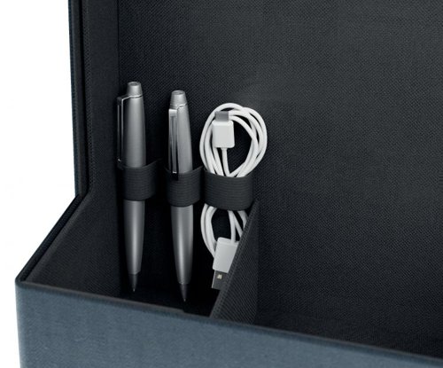 36133J | Make yourself at home wherever your day takes you with the Fabric Storage Range from Leitz. Featuring a minimalist design and an inviting matte grey velvet finish, this collection allows you to stay stylish while staying organised—whether at the office, at home, working hybrid, or anywhere in between. The Leitz Fabric Portable Desk Organiser with Handle boasts four separate compartments, providing ample space to store everything you need for the day ahead. Work from anywhere with this modern, practical, and stylish desk tidy box, which has enough room for a 15" laptop, a compact keyboard, a mouse, a charging cable, a headset, a notebook, and a water bottle. The sleek wooden handle makes it easy and comfortable to move from one desk to another.When the day is done, your portable office caddy, measuring 38 x 19 x 26 cm, can be easily stored in a cabinet, locker, or on a shelf to free up valuable space. This compact desk storage solution isn't just for hot desking; it's also ideal for organising your arts and crafts or other hobby essentials, with a maximum weight limit of 8 kg.Made from soft materials to protect your equipment from scratches, it is also reinforced with recycled cardboard for added strength and durability. Overall, it contains 52% recycled content.Understanding that space can be limited, this desk tidy box can be collapsed for easy storage when not in use. It’s the perfect addition for home, office, or school, helping you stay organised, productive, stress-free, and feeling good at work and beyond.