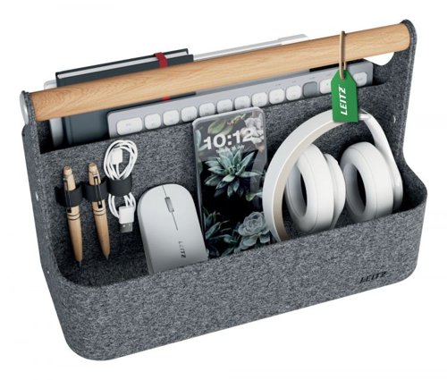 36134J | Our premium Leitz Portable Desk Organiser with Handle makes hot desking easier than ever. As you move from desk to desk, keep your essentials close and your workspace clutter-free with this stylish storage solution.Designed for hot desking and flexible workspaces, this desk tidy features two spacious compartments for storing your office essentials, such as your laptop, compact keyboard, water bottle, notebook, or mobile phone. Additionally, it includes three elastic holders for pens and cables, ensuring everything stays neatly organised and easily accessible. As they say, a tidy desk leads to a tidy mind.This portable office caddy is thoughtfully crafted from durable material made from 100% recycled post-consumer thermo felt and is delivered in plastic-free packaging. Plus, it looks great! The wooden handle adds a natural aesthetic and makes it easy and comfortable to transport. Its minimalist design, combined with an inviting grey velvet finish, keeps you stylish while staying organised on the move.Whether you're in the office, at home, or working in a hybrid setup, this compact desk storage solution is here to make your 9-to-5 easier. Beyond work, it’s also ideal for storing your art and craft supplies or other hobby essentials, with a maximum weight limit of 7.5 kg.Once your workday is done, the Leitz Portable Desk Organiser can easily be stored in a cabinet, locker, or on a shelf, thanks to its dimensions of 38 x 19 x 25.5 cm, freeing up valuable space.Blending home comfort with practical, smart design, our Leitz Portable Desk Organiser with Handle is the perfect addition for your home, office, or school. Stay organised, productive, and stress-free while feeling great at work and beyond.