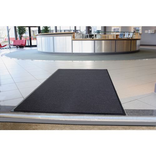SBY06727 | Whether it's for use indoors or outdoors, this entrance mat will not only help the cleanliness of your establishment, but also provide a safety aspect with its superior non-slip properties. The charcoal mat is ribbed, removing dirt, grit and moisture from the underside of shoes, but it won't stain with any dirt and can be easily laundered to stay hygienic. Manufactured from durable polypropylene, the mat is 100% slip resistant.