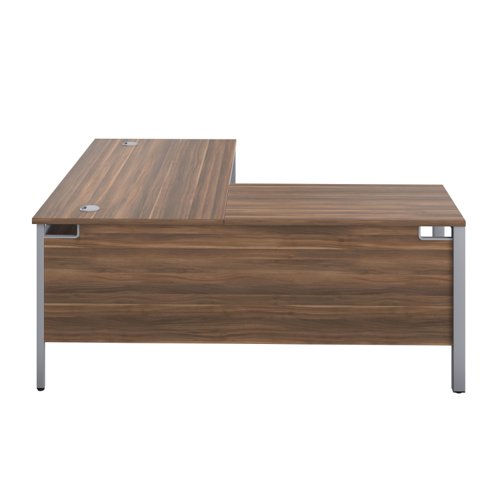 The Goal Post Left Hand Return Desk is the perfect addition to any modern office space. With its ultra-modern goalpost leg design and modesty panel, this return style desk is both stylish and functional. The secure and sturdy frame ensures long-lasting use, while the durable and well-joined tops provide a timeless finish. The 25mm top thickness adds to the desk's durability and strength. This desk is perfect for those who want a sleek and modern look in their workspace, without sacrificing functionality or durability. Invest in the Goal Post Left Hand Return Desk for a stylish and practical addition to your office.