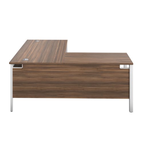 The Goal Post Left Hand Return Desk is the perfect addition to any modern office space. With its ultra-modern goalpost leg design and modesty panel, this return style desk is both stylish and functional. The secure and sturdy frame ensures long-lasting use, while the durable and well-joined tops provide a timeless finish. The 25mm top thickness adds to the desk's durability and strength. This desk is perfect for those who want a sleek and modern look in their workspace, without sacrificing functionality or durability. Invest in the Goal Post Left Hand Return Desk for a stylish and practical addition to your office.