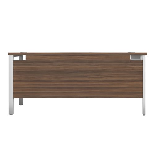 The Goal Post Left Hand Return Desk is the perfect addition to any modern office space. With its ultra-modern goalpost leg design and modesty panel, this return style desk is both stylish and functional. The secure and sturdy frame ensures long-lasting use, while the durable and well-joined tops provide a timeless finish. The 25mm top thickness adds to the desk's durability and strength. This desk is perfect for those who want a sleek and modern look in their workspace, without sacrificing functionality or durability. Invest in the Goal Post Left Hand Return Desk for a stylish and practical addition to your office.