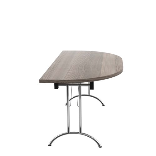 OUFT1680DENDSVGO | The One Union D-End Folding Table is a versatile piece of furniture that is perfect for multi-functional rooms where space is at a premium. The D-End shaped tilting table allows for easy adjustment with manual adjustment thumb wheels to tilt the top to the desired angle. The table is also mobile, thanks to the lockable castors, making it easy to move around as needed. When not in use, the table can be nested away for space saving. This table is ideal for use in offices, schools, or any space where flexibility and functionality are key. With its durable construction and sleek design, the One Union D-End Folding Table is a great investment for any space.