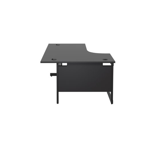 SU1812LHRADBKBK | The Single Upright Left Hand Radial Desk is the perfect addition to any modern office space. With its sleek and stylish design, this desk features a cantilever leg and is available in white, black, and silver legs to match any decor. The desk also comes with cable ports as a standard feature, making it easy to keep your workspace organised and clutter-free. Additionally, the adjustable feet allow for easy levelling on uneven floors, while the included modesty panels provide added privacy and a professional look. Whether you're working from home or in a busy office, this desk is sure to provide the functionality and style you need to stay productive and comfortable all day long.