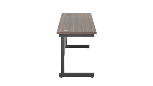 SU1860RECDWBK | The Single Upright Rectangular Desk, with its sleek and stylish design, this Modern cantilever leg rectangular office desk is available in white, black and silver legs to suit any decor. The desk comes with cable ports supplied as a standard, making it easy to keep your workspace tidy and organised. The adjustable feet ensure that the desk is level on uneven floors, while the included modesty panels provide privacy and a professional look. Whether you're working from home or in the office, our Single Upright Rectangular Desk is the ideal choice for a comfortable and productive workspace.