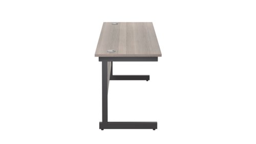 SU1860RECGOBK | The Single Upright Rectangular Desk, with its sleek and stylish design, this Modern cantilever leg rectangular office desk is available in white, black and silver legs to suit any decor. The desk comes with cable ports supplied as a standard, making it easy to keep your workspace tidy and organised. The adjustable feet ensure that the desk is level on uneven floors, while the included modesty panels provide privacy and a professional look. Whether you're working from home or in the office, our Single Upright Rectangular Desk is the ideal choice for a comfortable and productive workspace.