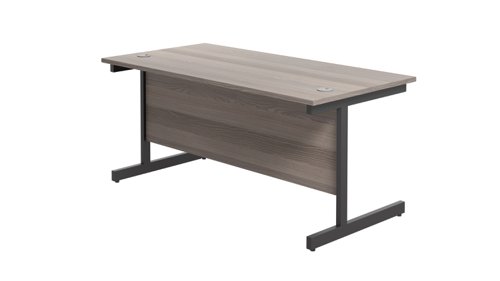 SU1880RECGOBK | The Single Upright Rectangular Desk, with its sleek and stylish design, this Modern cantilever leg rectangular office desk is available in white, black and silver legs to suit any decor. The desk comes with cable ports supplied as a standard, making it easy to keep your workspace tidy and organised. The adjustable feet ensure that the desk is level on uneven floors, while the included modesty panels provide privacy and a professional look. Whether you're working from home or in the office, our Single Upright Rectangular Desk is the ideal choice for a comfortable and productive workspace.