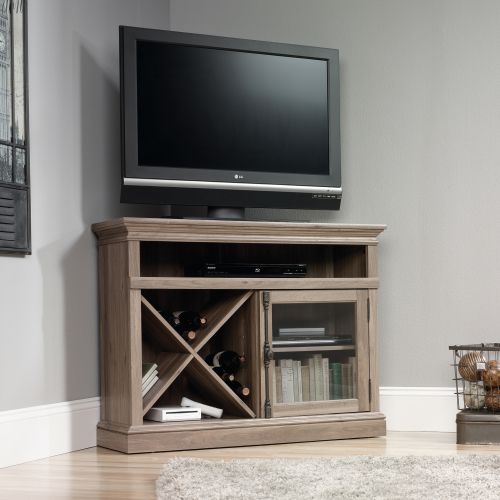 5414729 | The Teknik Office Barrister Home Corner TV Stand in a Salt Oak finish is a perfect solution for those tight spaces around your home! This clean, classy and sturdy stand provides a spacious platform that can hold up to a 42in TV, as well as two adjustable shelves that can house a miscellany of audio/video equipment. It has a salt oak finish framed, safety-tempered glass door with an elegant contrasting black metal handle which protects the shelves and in addition to that, it also boasts a stylish removable criss cross storage rack. The top of the stand houses an internal long open shelf, making it ideal for those binge watching marathons and gamers alike! The useful enclosed back panel with cord access enables simplicity and neatness as does the neutral coloured Salt Oak finish, ensuring it's an ideal match for all rooms and colour schemes. There are also co-ordinating furniture items under the Barrister Home Range that will complement this TV Stand.