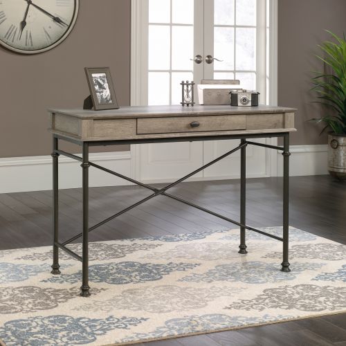 The Teknik Office Canal Heights Console Desk is our decorative and minimalist design option for any home office or study. This durable yet sleek looking desk provides a spacious platform for all manner of home study activities, as well as housing an easy glide drawer featuring full extension slides to stash away your stationery, keyboard or laptop. The drawer also benefits from a flip-down front for easy access. The sturdy powder-coated black metal rear crossbar frame coupled with the neutral coloured northern oak finish top ensure it's an ideal match for all rooms and colour schemes. It also has the added benefit of being finished on all sides for versatile placement within your home or office. There are also co-ordinating furniture items under the Canal Heights Range that will complement this Console desk.