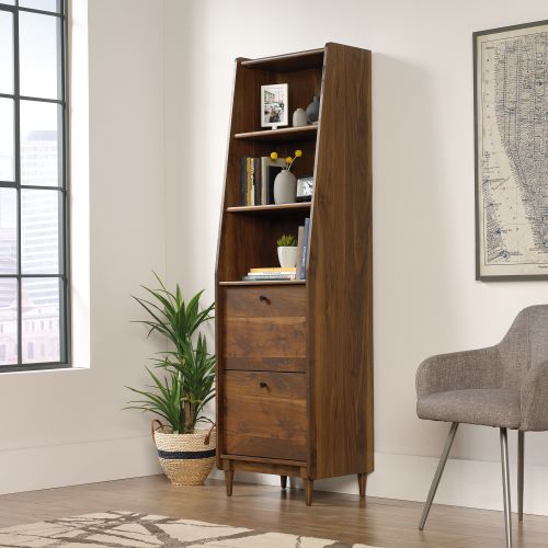 12921TK | The Teknik Office Hampstead Park Narrow Bookcase is our stylish and spacious design option for any home office or study. Beautifully finished in a Grand Walnut effect with solid wooden feet, this mid century styled bookcase provides a roomy and neutrally coloured storage solution for all your accessories, files, books and folders, an ideal match for all colour schemes. This classic yet remarkably modern looking bookcase also features an enclosed back with cord access, two fixed display shelves and two file drawers with full extension slides to hold letter, legal, or European size hanging files â€“ perfect for all your organisational needs. It also has the added benefit of being slimline and finished throughout so you can place the bookcase freestanding in any compact location and at any angle. Also ideal to match in this range are the Wide Bookcase, Compact Desk, Park Desk and Storage Stand, all finished in the same quintessential style.