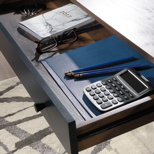 12914TK | The Teknik Office Hampstead Park Compact Desk is our stylish and minimalist design option for any home office or study. Its spacious work surface offers a perfect storage solution for all your office essentials and work items. This compact yet snappy looking desk features an easy gliding pencil drawer and file drawer with full extension slides to hold letter-size hanging files. Beautifully finished in a Grand Walnut effect with black accents and powdercoated metal base, this modern desk is just what your office has been missing! It also has the added benefit of being finished throughout so you can place the desk freestanding in any location and at any angle. Also ideal to match in this range are the Narrow Bookcase, Park Desk and Storage Stand, all finished in the same quintessential style.