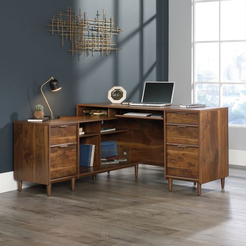 The Teknik Office Clifton Place L-Shaped Executive Desk is the charming and delightfully neutral coloured option for those that need the full office solution for their home office without taking up all the room! This mid century styles piece offers a slide out keyboard/mouse shelf that opens and closes on smooth metal runners, three easy gliding storage drawers and two file drawers with full extension slides that accommodate letter-size hanging files. It also features cubbyhole storage so you can access all of your books and folders. Space is no issue with this desk! The large desktop and return provides a generous working area for all types of work as well as there being access to cable ports and pass through openings for discreet cable management. The return can also be fastened on to the left or right side to fit the needs of any room in your home, which is ideal for all styles and colour schemes. Beautifully finished in a Grand Walnut effect with solid wooden feet, this storage sideboard will blend effortlessly within your home. This also benefits from a 360 degree finish, with the option to be freestanding. Also ideal to match in this range are the Executive Desk, Storage Sideboard, Credenza and Lateral Filer, all finished in the same quintessential style