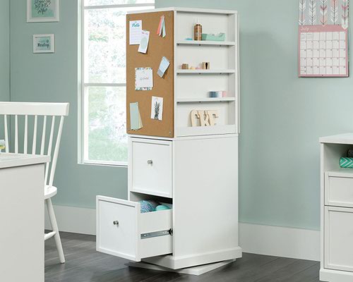 29315TK | The Teknik Office Craft Tower in a White finish is the delightfully simple office furniture offering ideal for any office or room in the house. It has a multitude of storage spaces for all of your craft needs, it sits on a swivel base which allows the tower to spin and turn, allowing easy access on all four sides. It features two adjustable storage drawers on full extension slides to discreetly store all of your accessories. It also has a pegboard back and corkboard panel to keep your craft items organised, along with metal trays which provide even more storage for those bit and pieces such as Sellotape, glue and scissors, never to be misplaced again!  This item also has a 360 degree all round finish, ideal for perfect placement within your workspace. 