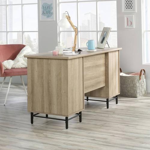 5423235 | The Teknik Office Avon Leather Handled Desk is a charming and delightfully contrasting coloured option for all styles of office and colour schemes.  This fresh and modern styled desk benefits from a large desktop working surface in Sky Oak effect finish which provides more than ample space for writing and computer work. It also includes two file drawers with full extension slides for holding letter-size hanging files as well as four storage drawers featuring metal runners with safety stops in a beautiful contrasting white accent. The drawer fronts also feature an unusual yet stunning addition of drawer pulls in durable brown leather for an extra touch of class. The desk top has grommet holes for electrical cord access to ensure you can wire up your necessary hardware in a neat and orderly fashion. Beautifully finished with a powder coated metal base, this desk will blend effortlessly within your working area. This desk also benefits from a 360 degree finish, with the option to be freestanding. 