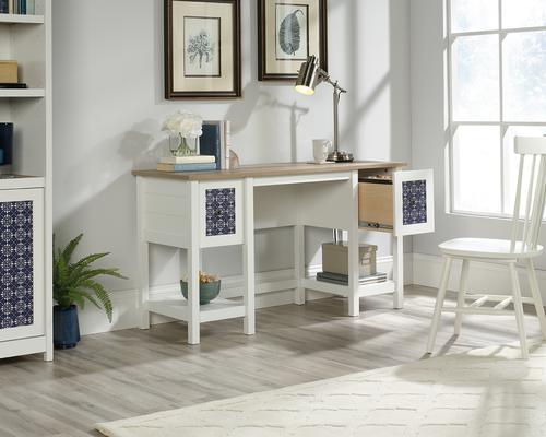 12851TK | The Teknik Office Mediterranean Shaker Style Desk in an appealing Soft White shade is a simple and clean looking style option, a perfect offering for the home office or study. The contrasting lintel oak accent desktop and the metal effect chic drawer handles and decorative tile pattern on the drawer fronts add to the shaker / beach hut tone of this highly crafted item. This desk has two drawers featuring the patented T-Lock assembly system, one of which can hold letter size hanging files. It also has two lower shelves for additional stationery management. The grand desktop provides a versatile and ample space for coursework, laptops, homework and study. It also has the added benefit of being finished throughout so you can place the desk freestanding in any location and at any angle. 