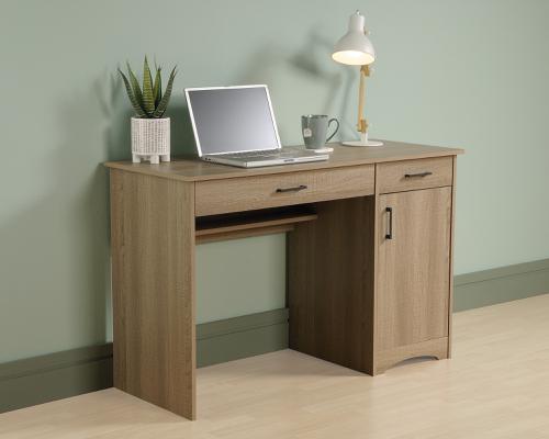 5424256 | The Teknik Office Essentials Computer Desk in Summer Oak is a fantastically functional option for the home, student and university halls where space is limited but computer work is utmost. This smart little desk offers a spacious top surface that provides you with the room you need for all your office essentials like your laptop, folders, collection of notepads and an accent lamp. This computer desk features a large drawer/shelf with a flip-down panel for your keyboard and mouse. The small storage drawer opens and closes on smooth metal runners for convenient storage for all your hidden stationery needs. This item also features a hidden storage area behind the door that includes an adjustable shelf and accommodates a vertical CPU tower. Other features includes a cord management system with pass-throughs for tidiness. The beautiful summer oak tone of this desk makes it an ideal match for all rooms and office colour schemes. 