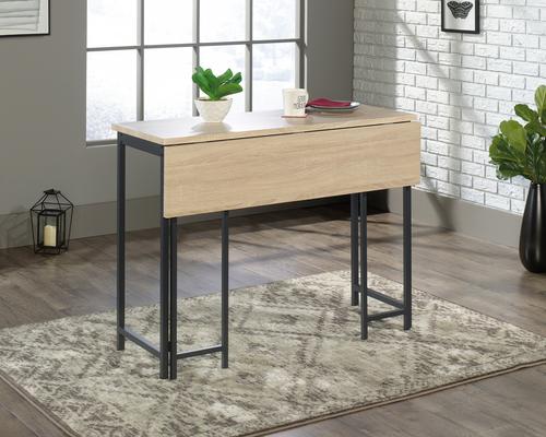 5424943 | The Teknik Office Industrial Style High Work Table with Flip Extension is our sharp and minimalist design option for the home office. This durable yet sleek looking table provides an attractive display area and additional spacious work area when you engage the flip up table top extension, perfect for all manner of home office study. The neutral and sturdy black metal frame coupled with the charter oak effect top ensure it's an ideal match for all rooms and colour schemes. It also has the added benefit of being finished throughout so you can place the desk freestanding in any location and at any angle.