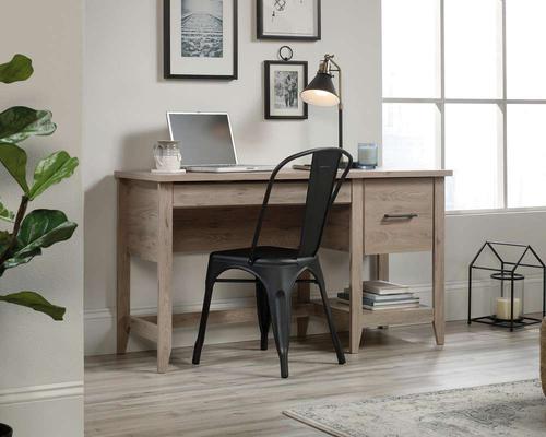 5425015 | The Teknik Office Summit Desk is a fantastic and solid option for all styles of office, providing ample space for writing and computer work. Finished in a stylish Laurel Oak, it benefits from a spacious work area, two drawers with metal runners and safety stops, one of those being a filing drawer for letter sized hanging files and a lower storage shelf. This desk also has a cable port for discreet cable management and a tapered leg detail. The sleek and simple design of this Summit desk ensured that this will always complement any home office colour schemes. 