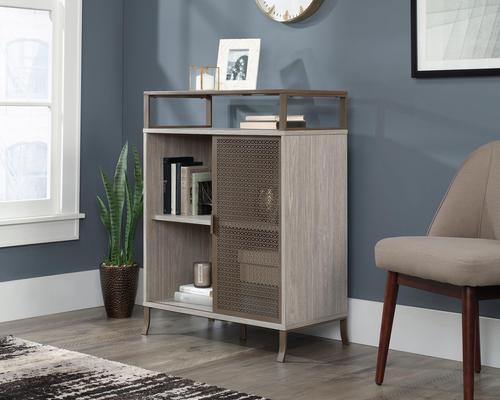 Teknik Office City Centre Cabinet with Sliding Door in Champagne Oak Finish with contrasting durable satin taupe metal feet two adjustable shelves and