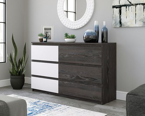 The Teknik Office Hudson Six Drawer Chest in Charcoal Ash Finish and Pearl Oak accents is a superb addition for the bedroom or storage area in the home.  This contemporary six drawer chest features a spacious top surface for storage and display of your favourite items and is safety tested to help reduce tip-over accidents. There are three large drawers in Charcoal Ash and three smaller drawers in a beautifully contrasting Pearl Oak, all six drawers are great for neatly stashing away all belongings or items of clothing. These drawers all feature metal runners with safety stops to offer easy-access storage. The top drawer is finished in a contrasting Pearl Oak accent for additional style points! The chamfered edge detailing on the drawer fronts add a touch of class and the charcoal ash effect finish ensure it's an ideal and seamless match for all rooms and colour schemes. There are also co-ordinating furniture items under the Hudson range that will complement this Six Drawer Chest.