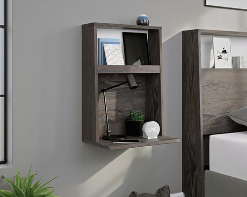 The Teknik Office Hudson Wall Mounted Night Stand in Charcoal Ash Finish and Pearl Oak accents is a superb addition for the bedroom or living space at home. This contemporary wall mounted night stand has discreet cord management at the back to feed through any charging points for your portable electronics to the open space saving surface which is all within easy reach. It also benefits from an additional top shelf trough with an attractive contrasting Pearl Oak accent back drop for additional storage of belongings.  The chamfered edge fronts add a touch of class and the charcoal ash effect finish ensure it's an ideal and seamless match for all rooms and colour schemes. It is also wall mounted which means it has vast options for versatile placement around the home. There are also co-ordinating furniture items under the Hudson range that will complement this Night Stand.