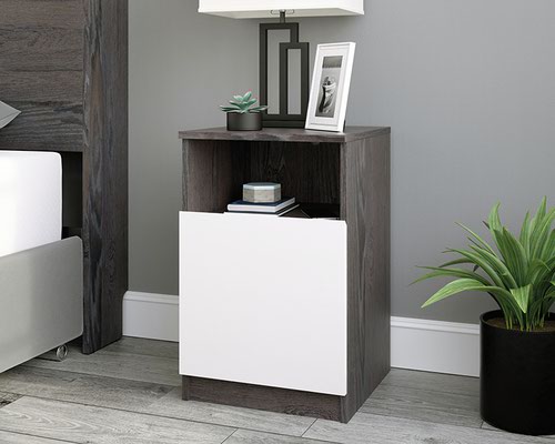 The Teknik Office Hudson Bedside Night Stand in Charcoal Ash Finish and Pearl Oak accents is a superb addition for the bedroom at home.  This contemporary night stand has discreet cord management at the back to feed through any charging points for your portable electronics to the open shelf which is all within reach. There is a modestly sized contrasting pearl oak accented effect drawer below for discreet storage of belongings which also features full extension slides for ease of movement. The chamfered edge fronts add a touch of class and the charcoal ash effect finish ensure it's an ideal and seamless match for all rooms and colour schemes. There are also co-ordinating furniture items under the Hudson range that will complement this Night Stand.