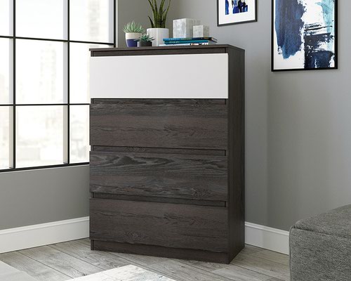 The Teknik Office Hudson Four Drawer Chest in Charcoal Ash Finish and Pearl Oak accents is a superb addition for the bedroom or storage area in the home.  This contemporary four drawer chest features a spacious top surface for storage and display of your favourite items and is safety tested to help reduce tip-over accidents. The four  sizable drawers are great for neatly stashing away all belongings or items of clothing. These drawers all feature metal runners with safety stops to offer easy-access storage. The top drawer is finished in a contrasting Pearl Oak accent for additional style points! The chamfered edge detailing on the drawer fronts add a touch of class and the charcoal ash effect finish ensure it's an ideal and seamless match for all rooms and colour schemes. There are also co-ordinating furniture items under the Hudson range that will complement this Four Drawer Chest.