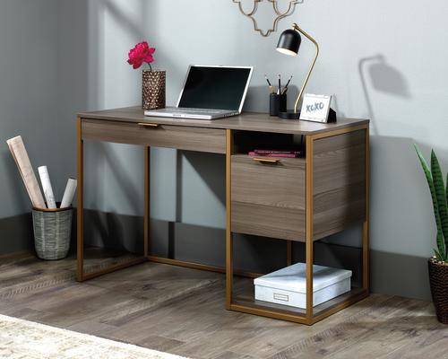 The Teknik Office Lux Desk in Diamond Ash finish is a great retro styled option for any study area of your home. This charming desk benefits from a generous work area, perfect for your laptop, work lamp and favourite coffee cup. It has a pencil drawer with metal runners and safety stops as well as convenient cubbyhole storage. Th desk is completed with a lower filing drawer with full extensions slides which can hold letter or legal size hanging files. The light brown durable powder coated metal frame complements the Diamond Ash finish perfectly, ensuring it's an ideal and seamless match for all rooms and colour schemes. 